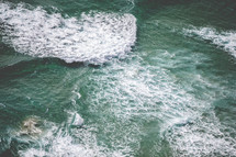 aerial view above waves in the ocean 
