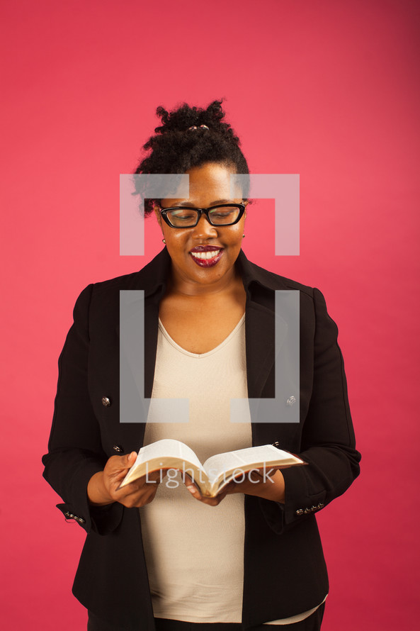 African American woman reading a Bible 