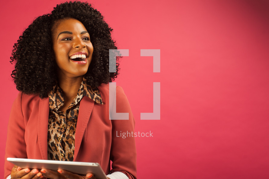 African American businesswoman holding an iPad 