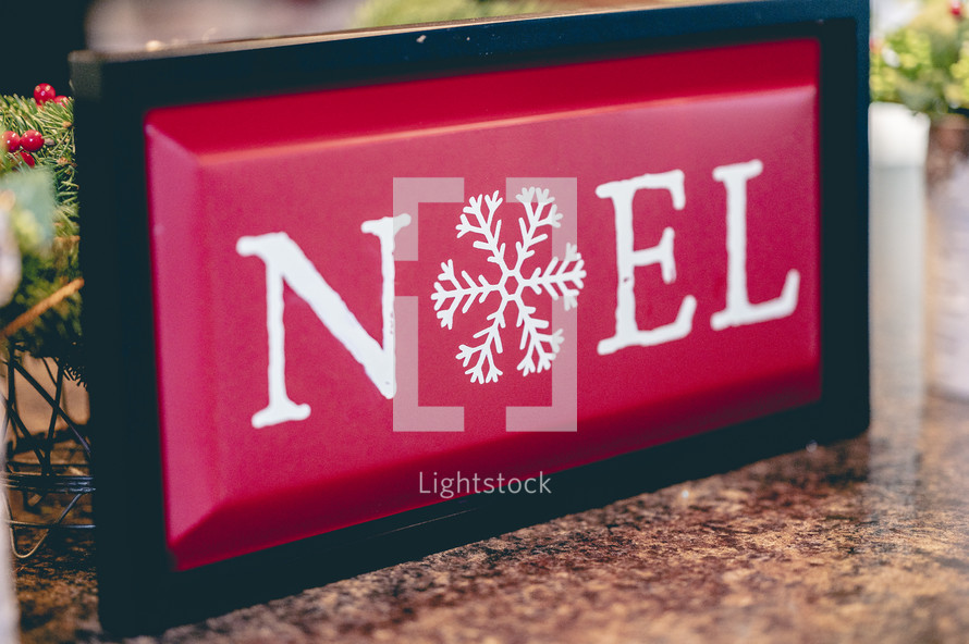 noel sign on a kitchen countertop 