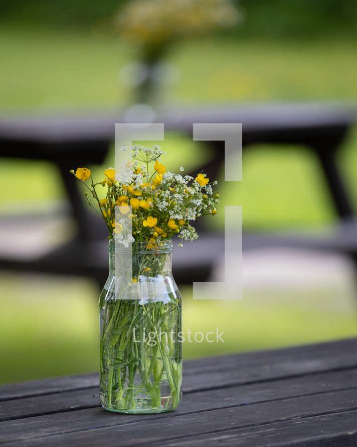 A bouquet of flowers in a glass jar