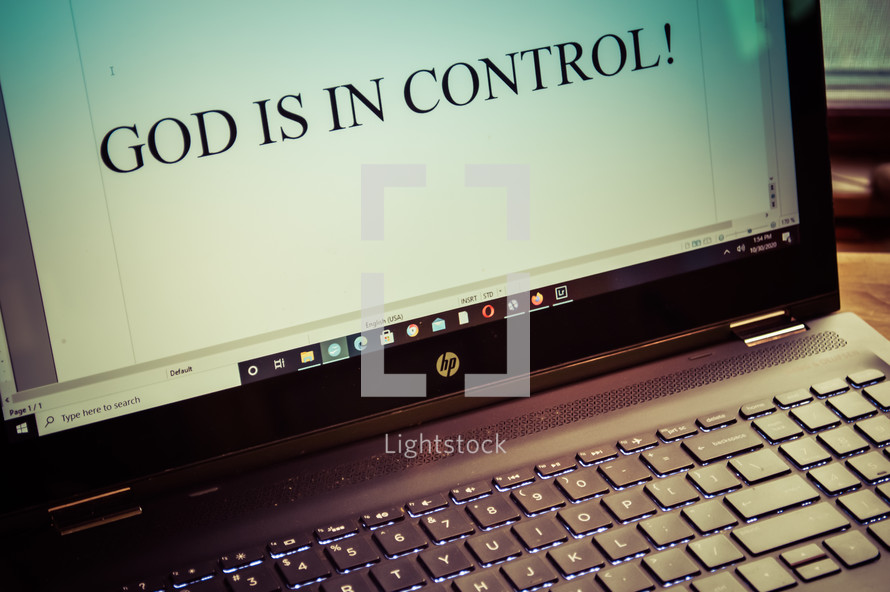 words God is in control on a computer screen 