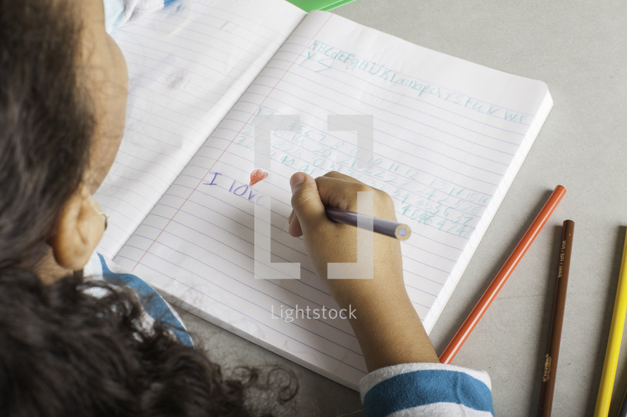 a girl writing a letter to Jesus 