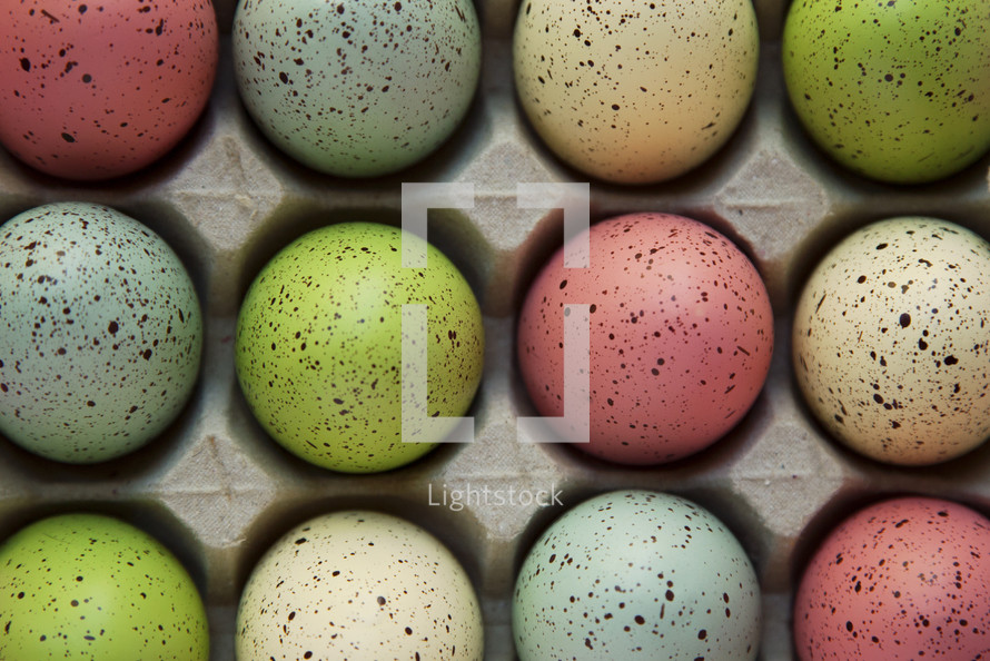 speckled Easter eggs in an egg carton 