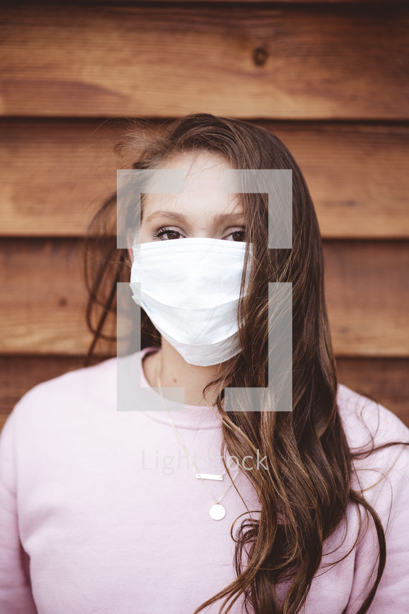 a woman wearing a surgical mask 