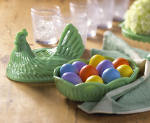 colored Easter eggs in rooster container