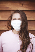 a woman wearing a surgical mask 