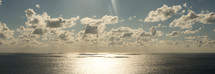 Panoramic view of the ocean outside Corfu in Greece with clouds in the sky during late in the day. 