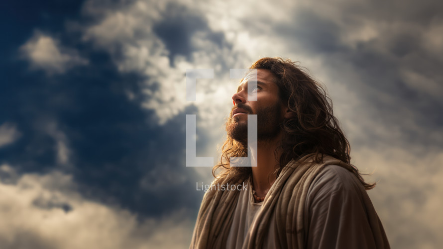 Low angle shot of Jesus looks up in prayer during his time of solitude. 