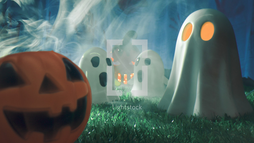 Passing Between Ghosts And Halloween Pumpkin