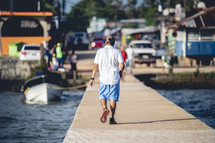 man walking on a dock in Honduras 