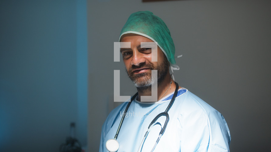 Italian Man Doctor smiles to reassure patients