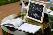 A wedding book on a sign-in table at a wedding.