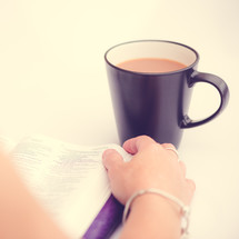 woman reading a Bible and coffee 