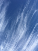 wispy clouds in a blue sky 