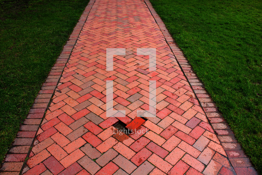 misplaced brick on a path