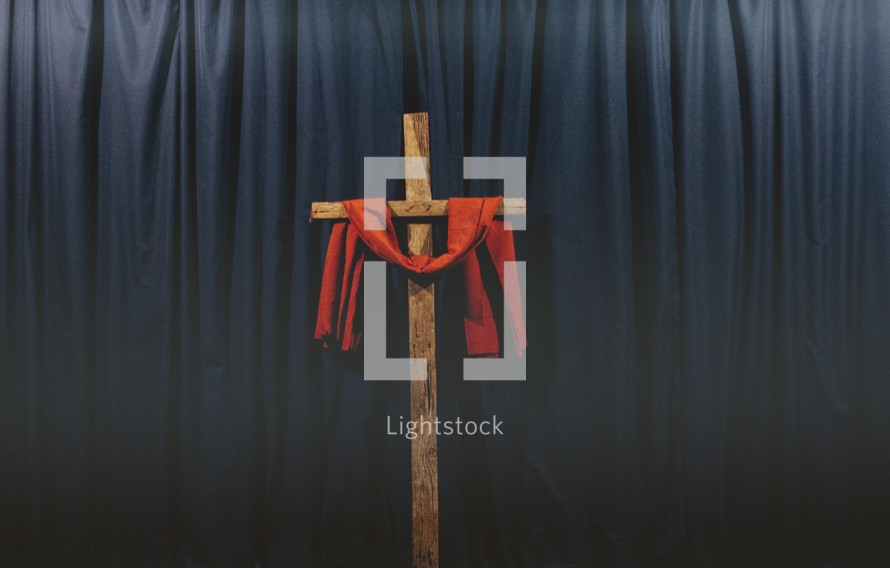 red shroud over a wooden cross