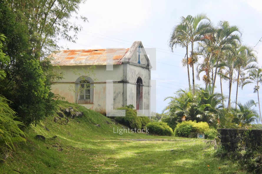 an old church and palm trees 
