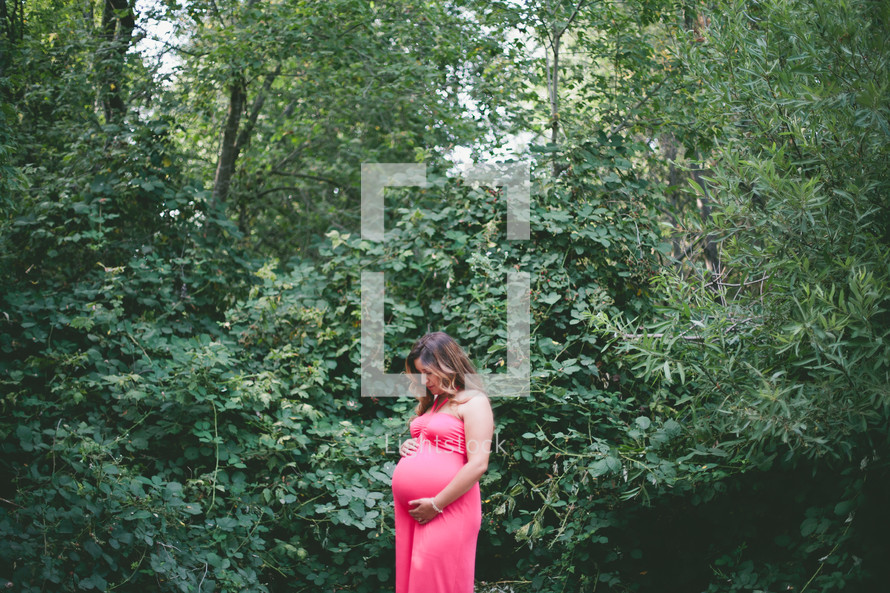 pregnant woman in a forest 