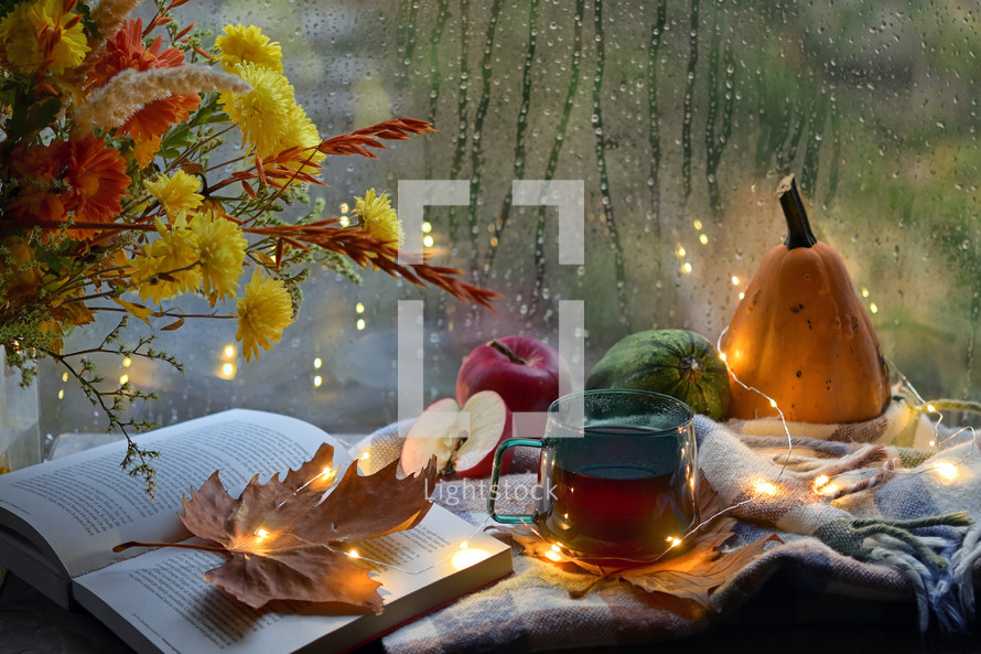 Autumn Decor with Flowers, Open Book and Cup Of Tea