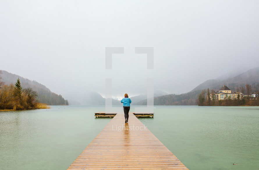 a woman walking on a dock in Austria 