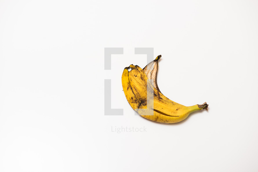 spoiled banana peel on an isolated white background with copy space