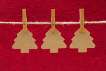  Christmas tree cut-outs hanging on a string 