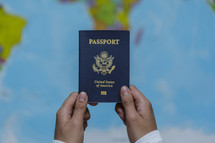 hands holding up a passport 
