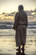 Jesus standing on a beach 
