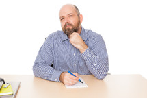 man thinking with a pen notepad 