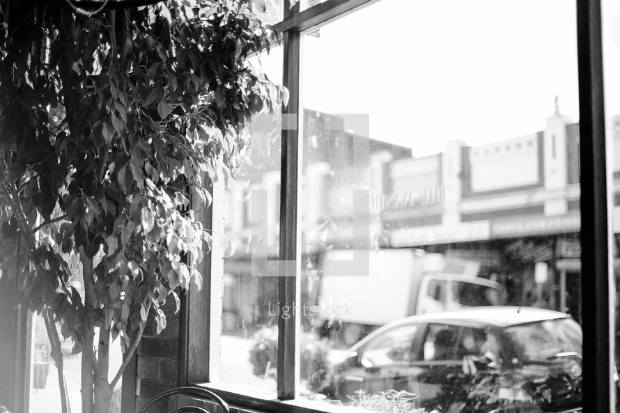 View out the window of a quiet café. Who are you waiting to see? 
Black-and-white, vintage feel.