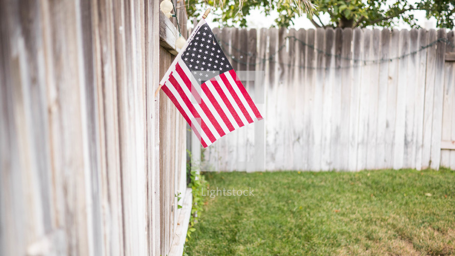 American flag on a fence 