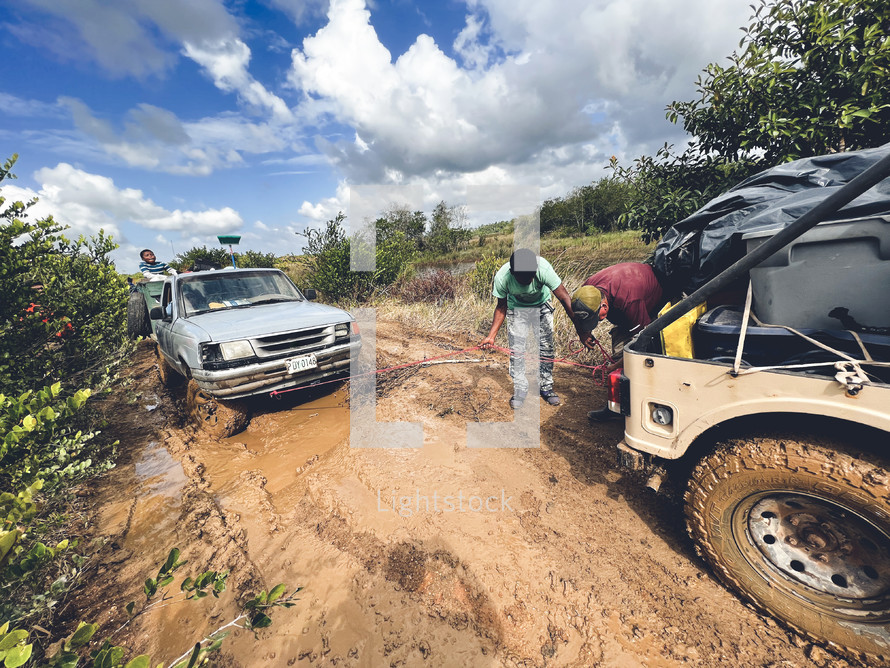towing a vehile on a dirt road in Honduras 