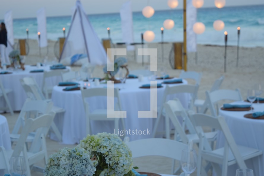 A reception on the beach at sunset 
