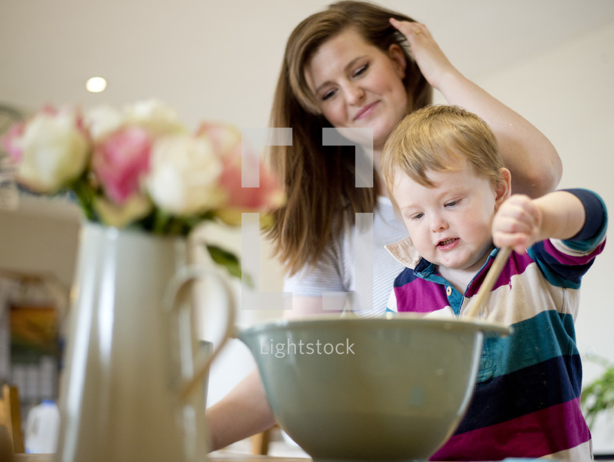 mother and son baking in a kitchen 