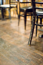 Cafe chairs on a wood floor.