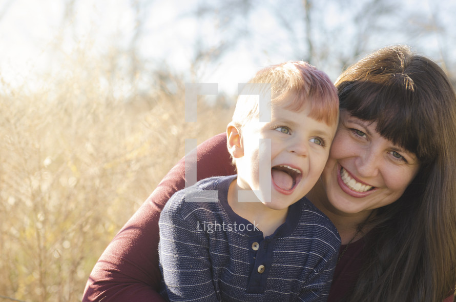 portrait of a smiling mother and son
