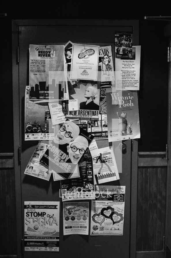 flyers and announcements on a door 