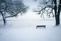 bench by a lake in winter 