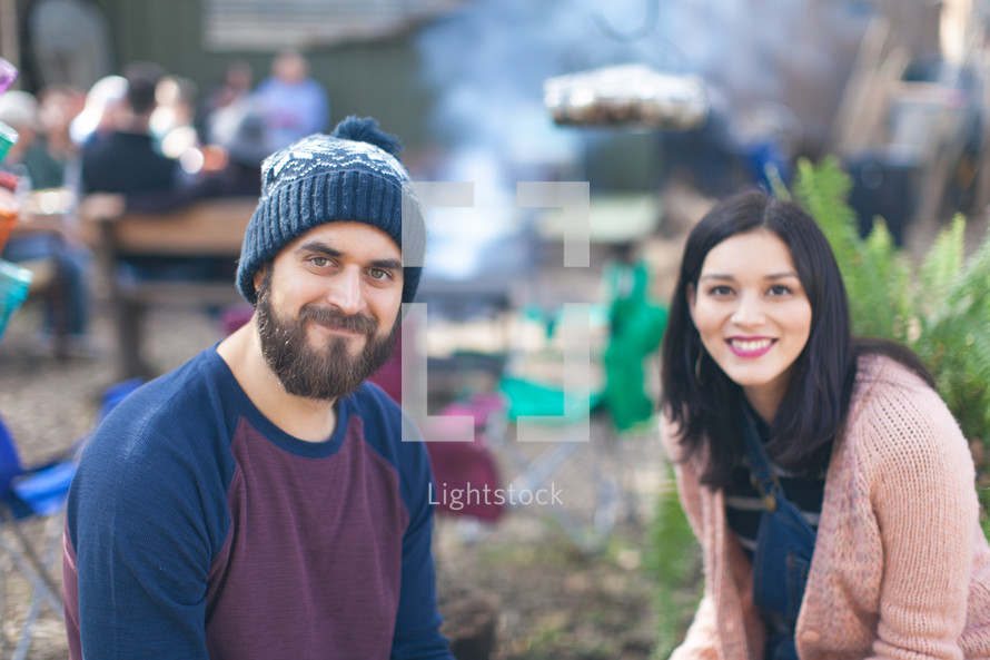 a couple at an outdoor cookout 