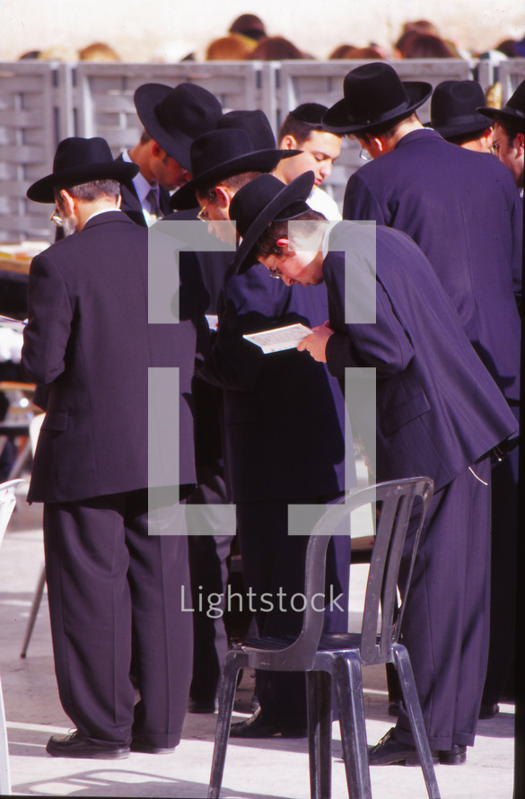 men in prayer in Jerusalem 
