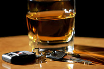 Drinking and Driving – An image of a glass of liquor and car keys symbolize the concept of drinking and driving.