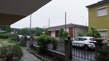 Cars Parked In The Driveway On A Rainy Day