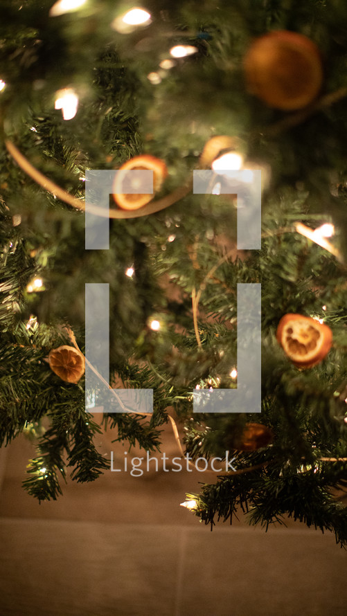 decorations and white lights on a Christmas tree 