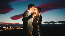 Lovely Couple At Sunset With Fairy Light