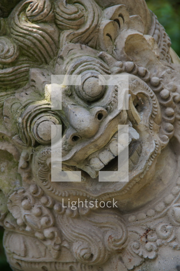 Stone carving of evil face of Indonesian deity 