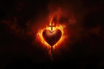 The Sacred Heart, a burning heart on a dark background with a cross in the center with copy space