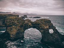 arch rock formation in the ocean 