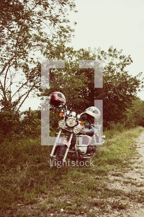 Motorcycle on side of dirt ride