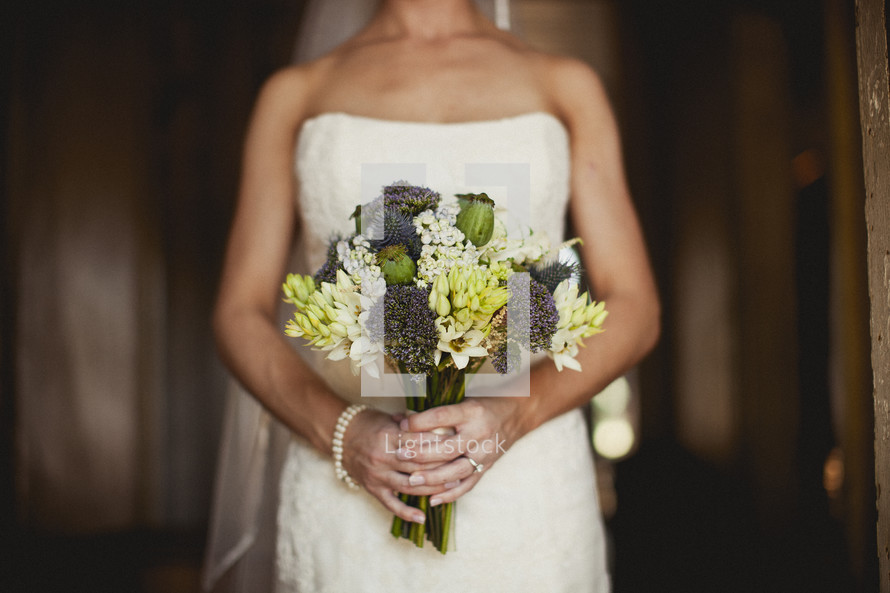 A bride holding a bouquet of flowers